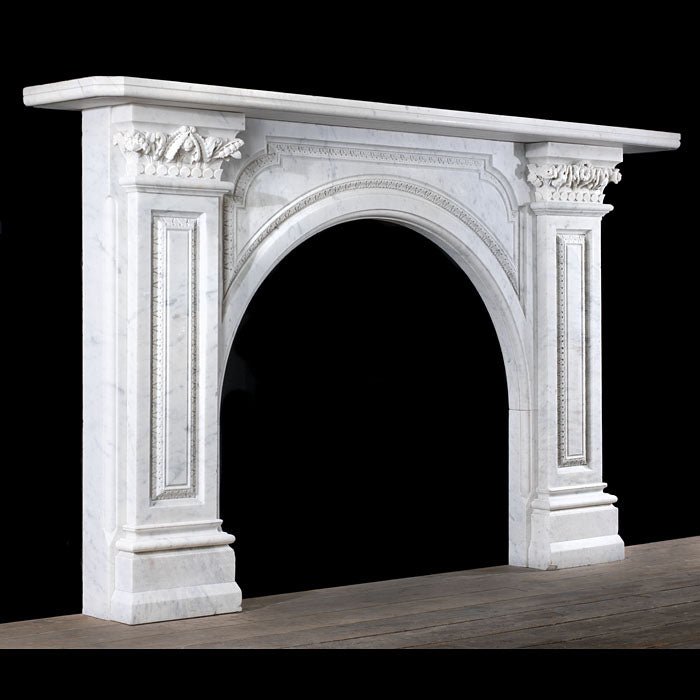 Grand Victorian Carrara marble fireplace with Corinthian capitals styled in formal drawing room