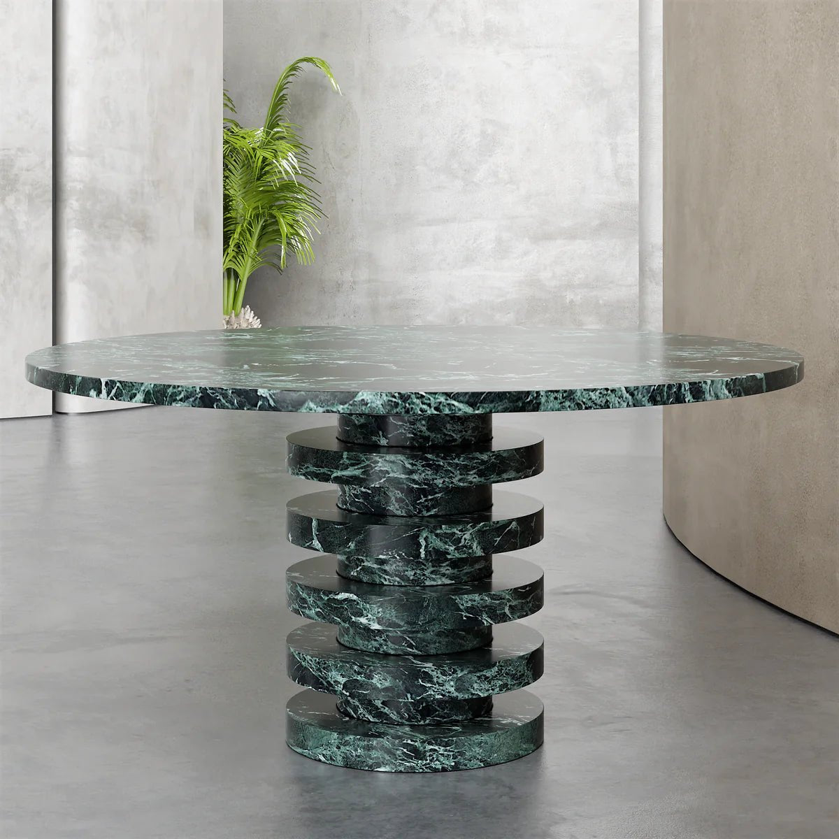 Verde Alpi marble dining table angled view showing six graduated stone disc pedestal base