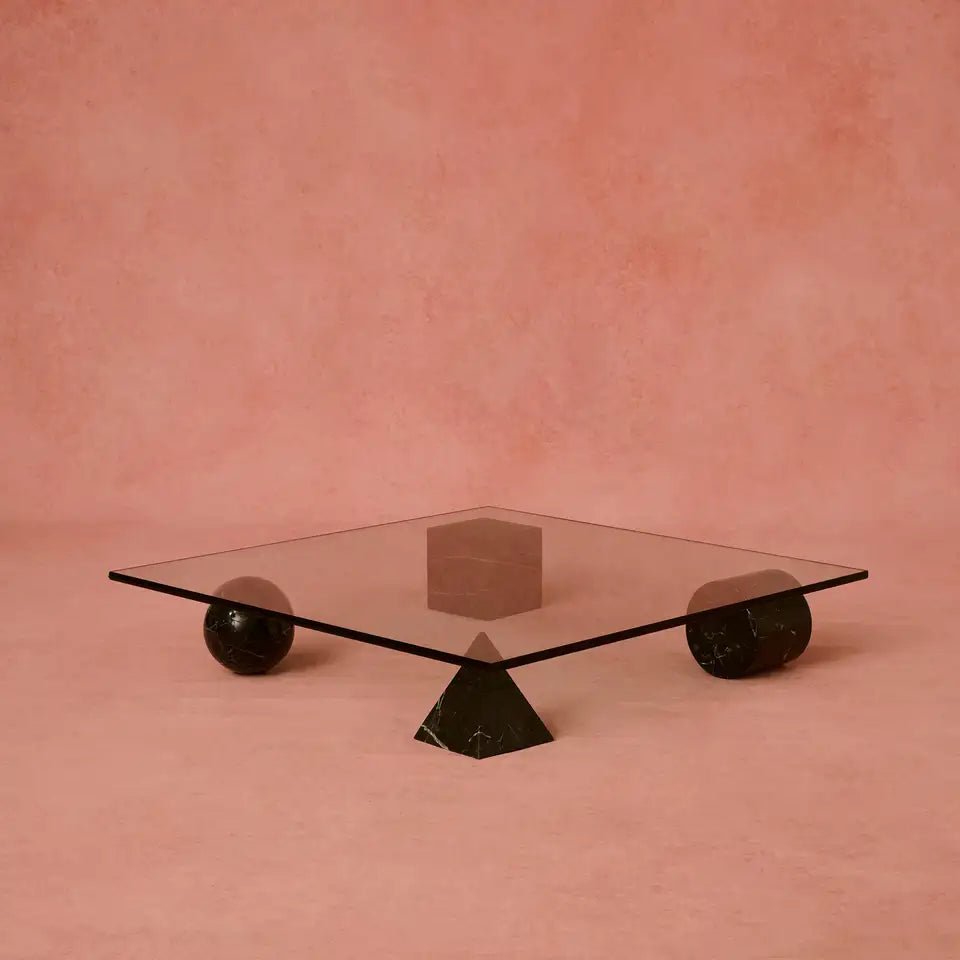 Meteora coffee table — four Nero Marquina marble geometric forms supporting 1200mm square glass top