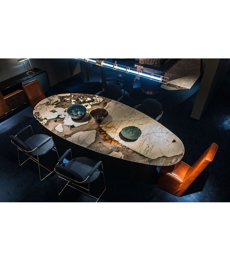 Sienna Patagonia quartzite oval dining table top-down view showing dramatic stone patterning across 2900mm surface