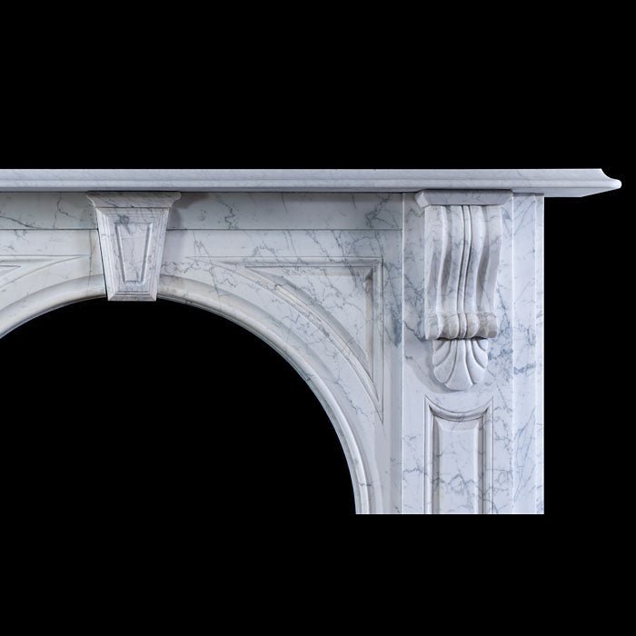 Carved keystone detail at crown of arch on Victorian Carrara marble fireplace surround