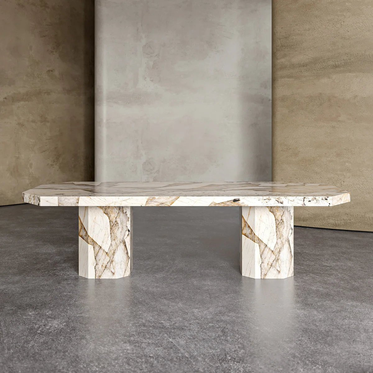 Forma Patagonia quartzite dining table side view — chamfered octagonal top and two faceted stone pedestals, 2200mm seats 8