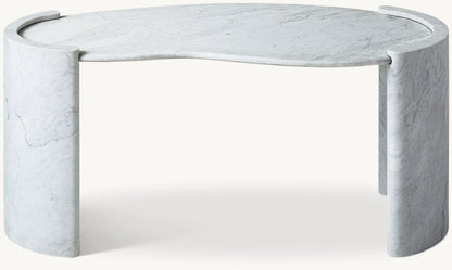 Coco marble desk in Carrara — organic curved white marble top with solid stone column legs, front view