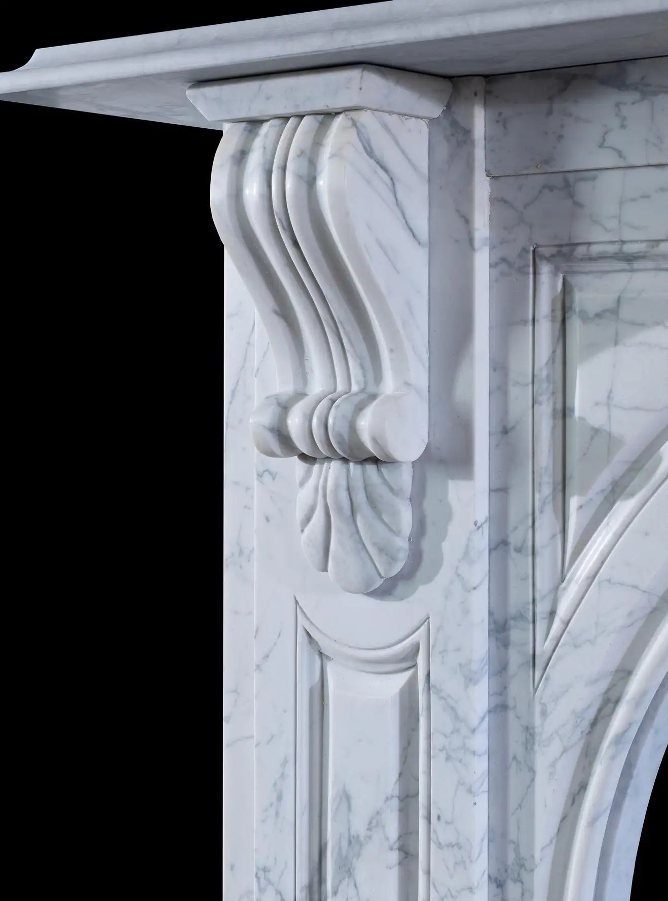 Shell corbel detail on Victorian Carrara marble fireplace surround — hand-carved classical shell form