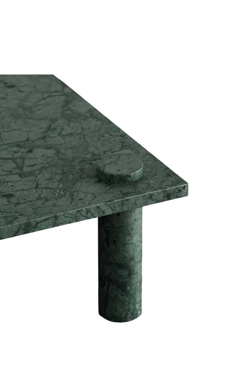 Close up of Verde Guatemala marble surface on Adamo coffee table showing deep green stone and white veining
