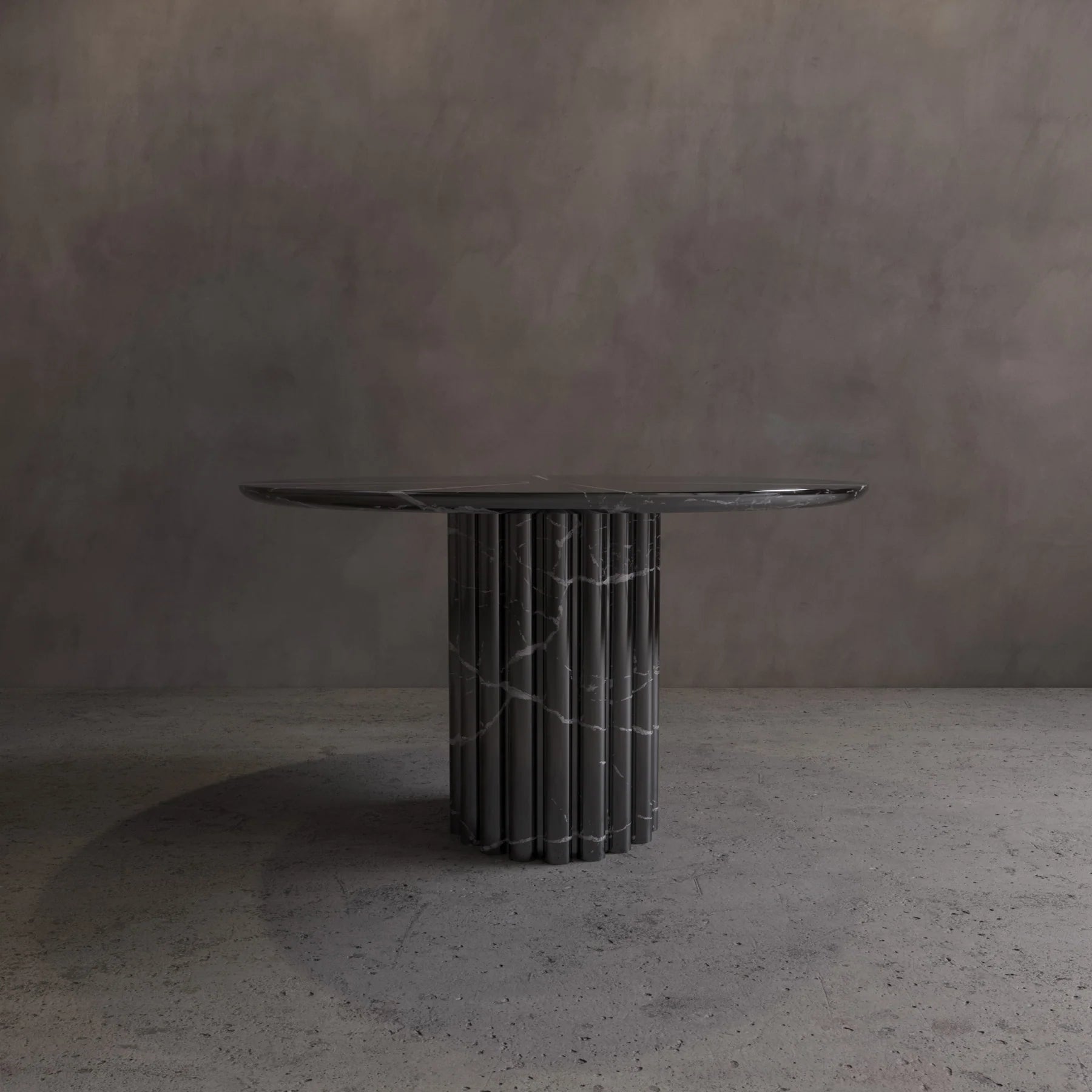 Amara Nero Marquina round dining table — single fluted column pedestal base, 1300mm diameter seats 6
