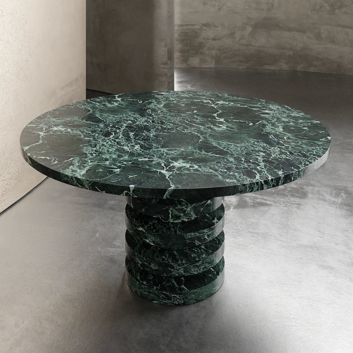Verde Alpi round marble dining table top-down view showing circular form and natural stone veining