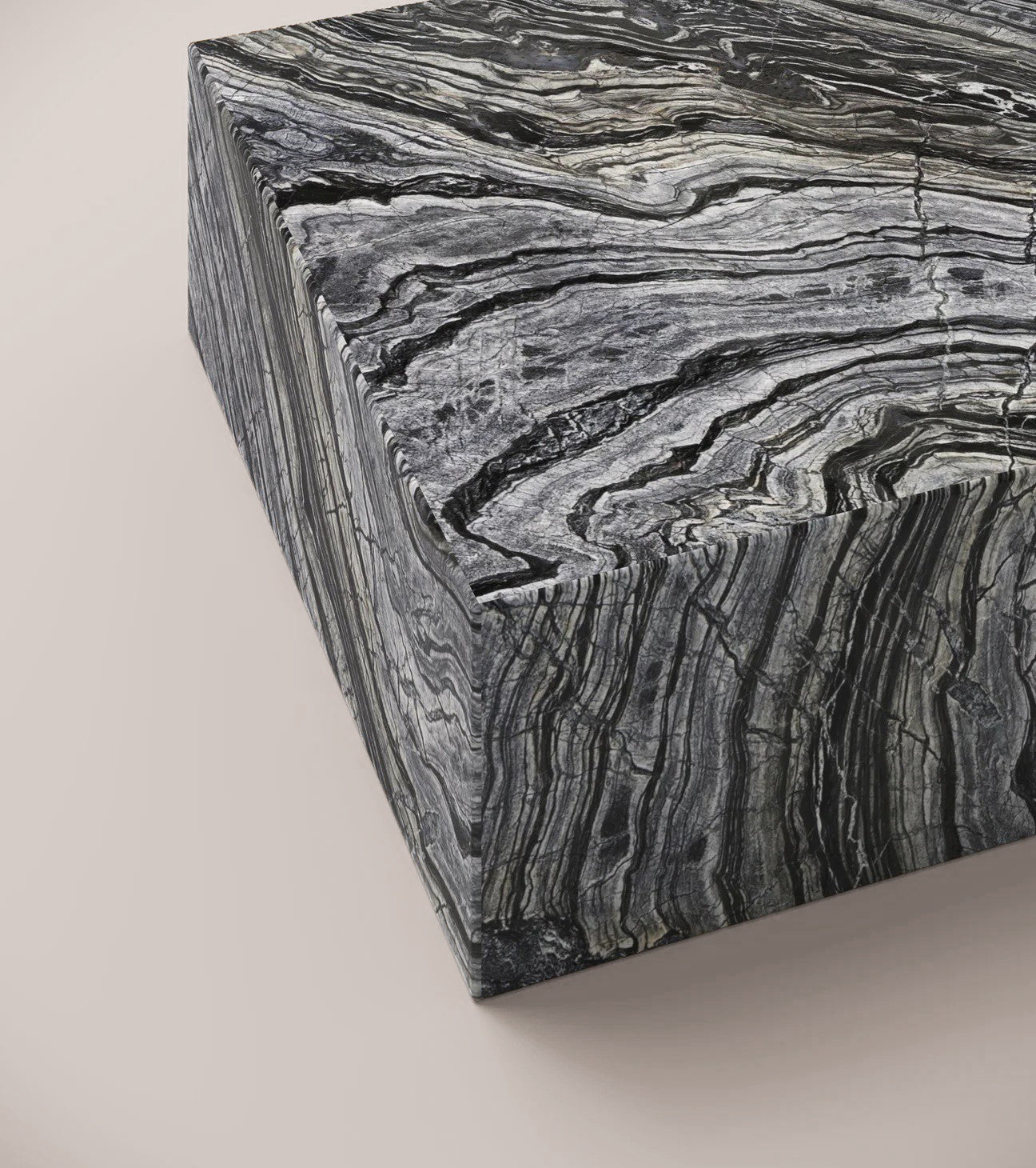Close up of Nero Marquina plinth coffee table surface showing opaque black stone and white veins