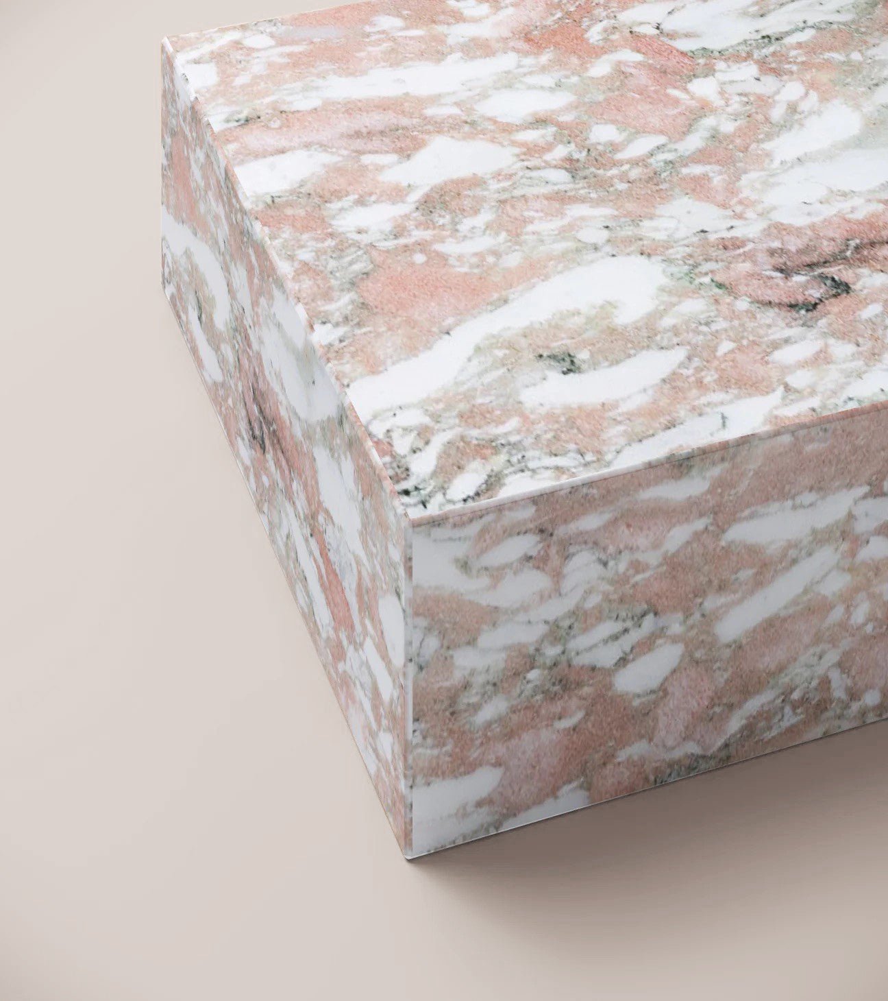 Close up of Norwegian Rose plinth coffee table surface showing pink tones and natural veining